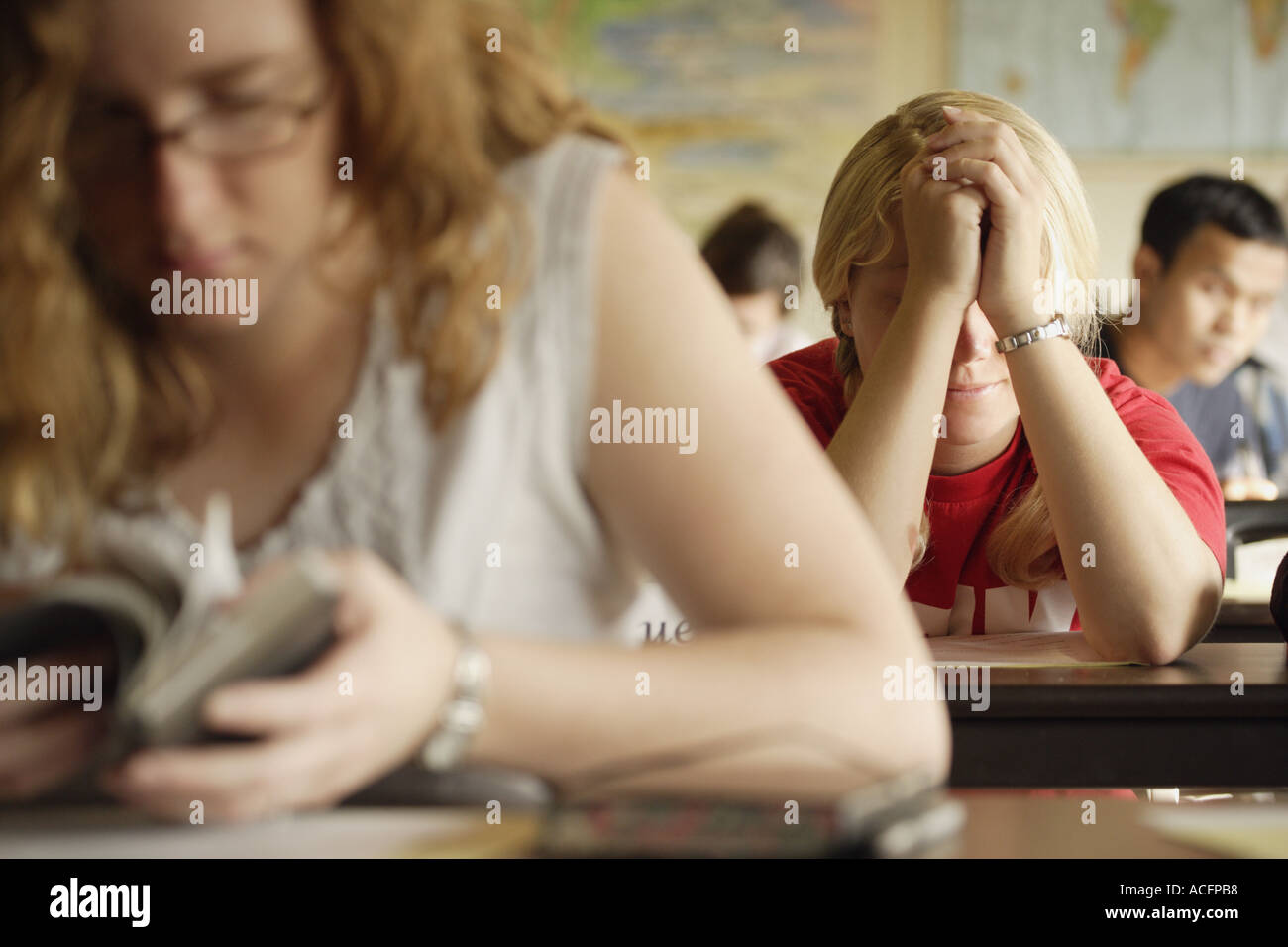 Students at a bible study and prayer class Stock Photo