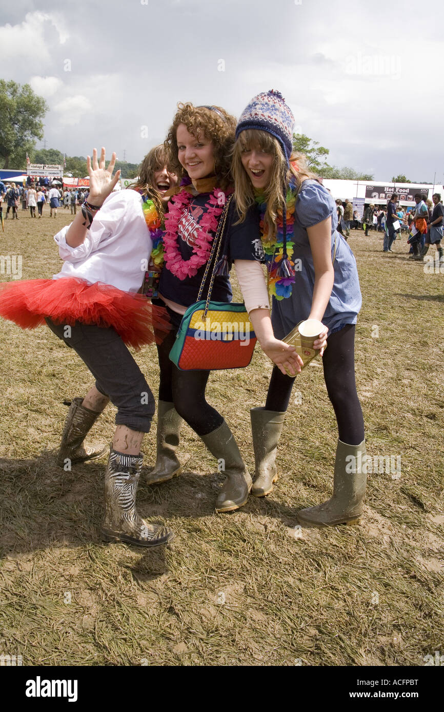 Girls wearing muddy boots at the Glastonbury Festival 2007 Stock Photo