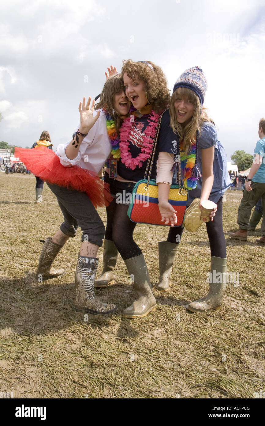 Girls wearing muddy boots at the Glastonbury Festival 2007 Stock Photo