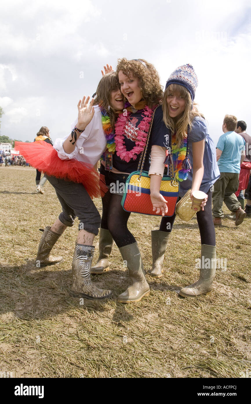Girls wearing muddy boots at the Glastonbury Festival 2007 Stock Photo