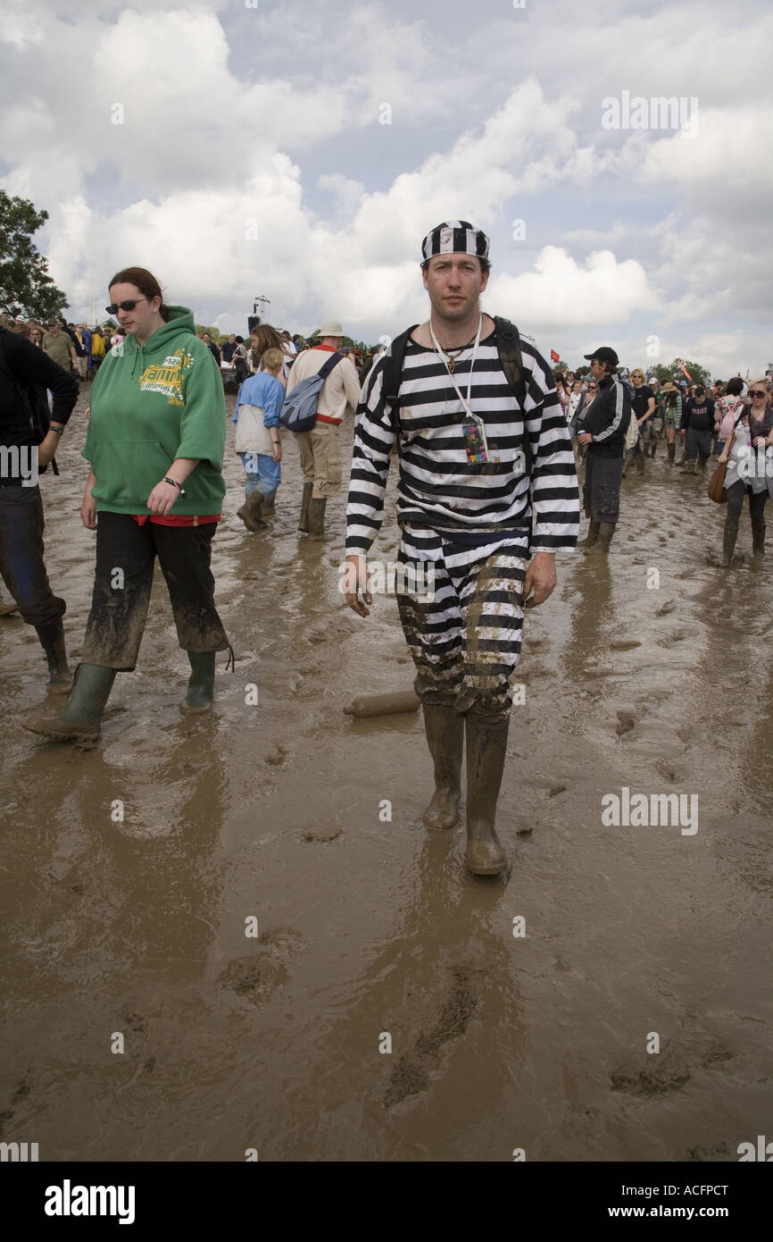 Man dressed in fancy dress prison stripes at the Glastonbury festival 2007 Stock Photo