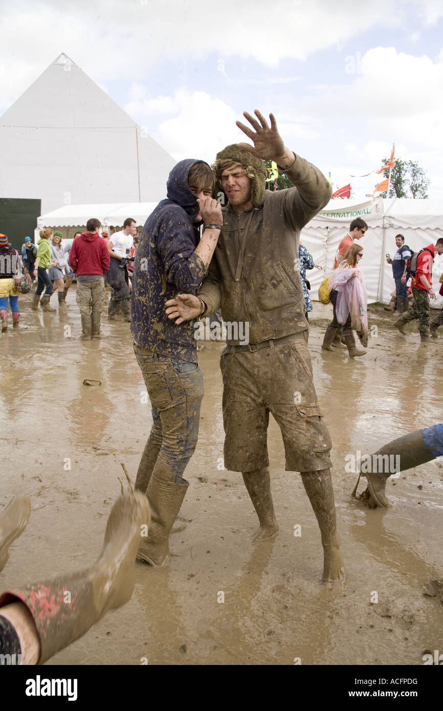 Two happy guys covered in mud at the Glastonbury festival 2007 Stock Photo