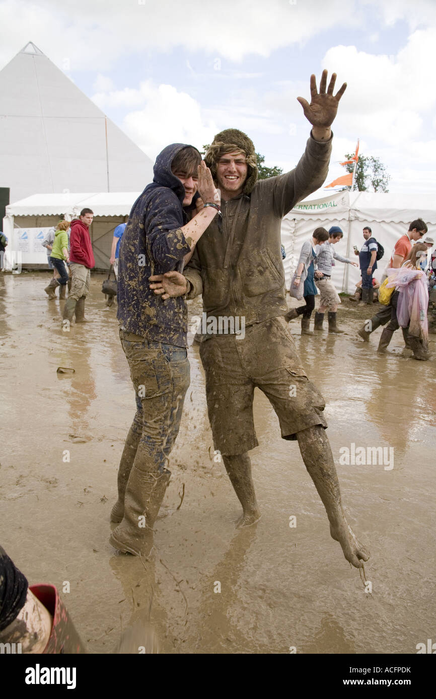 Two happy guys covered in mud at the Glastonbury festival 2007 Stock Photo