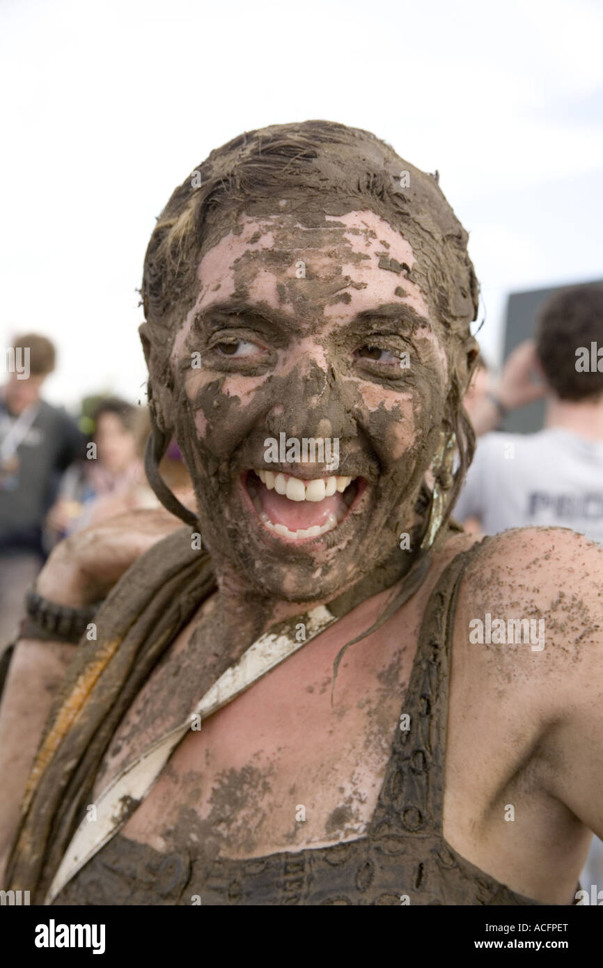 Woman with her face covered in mud at the Glastonbury Festival 2007 ...
