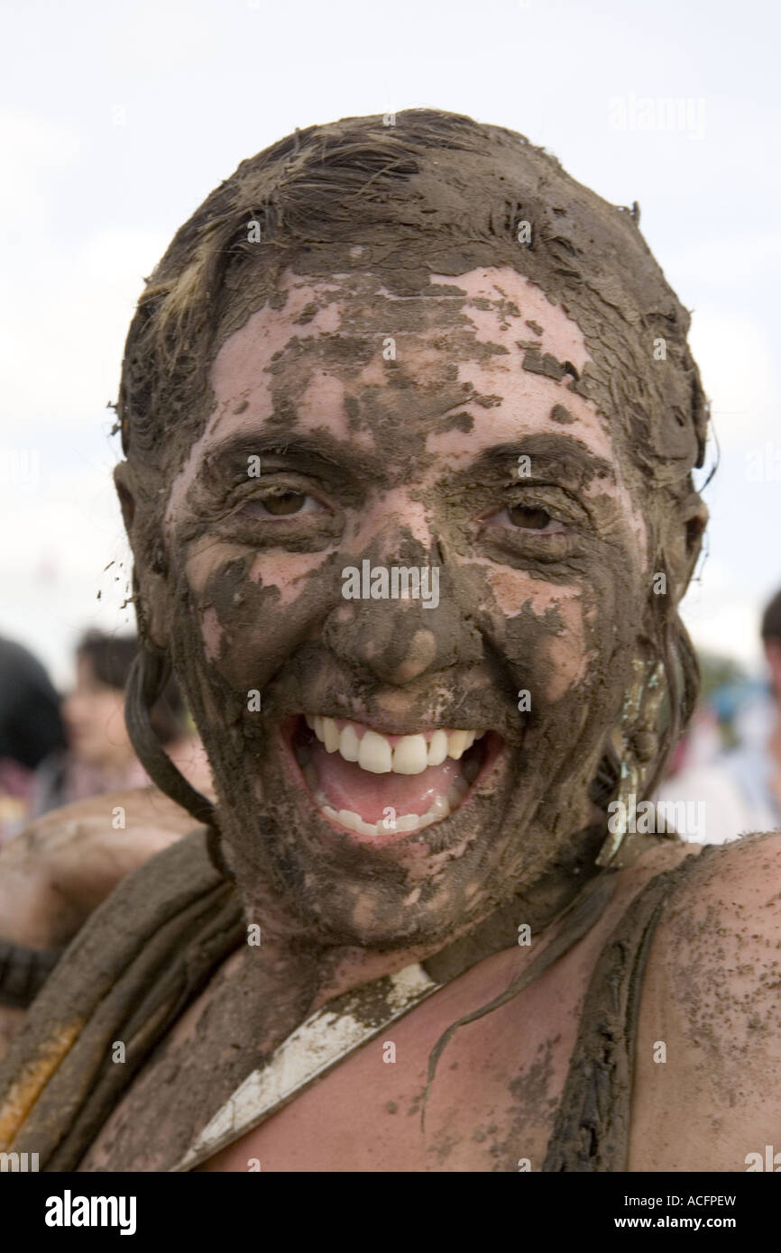 Woman with her face covered in mud at the Glastonbury Festival 2007 Stock Photo