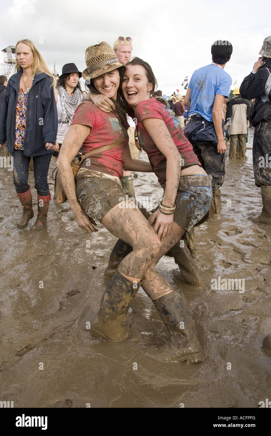 Two girls covered in mud at the Glastonbury Festival 2007 Stock Photo