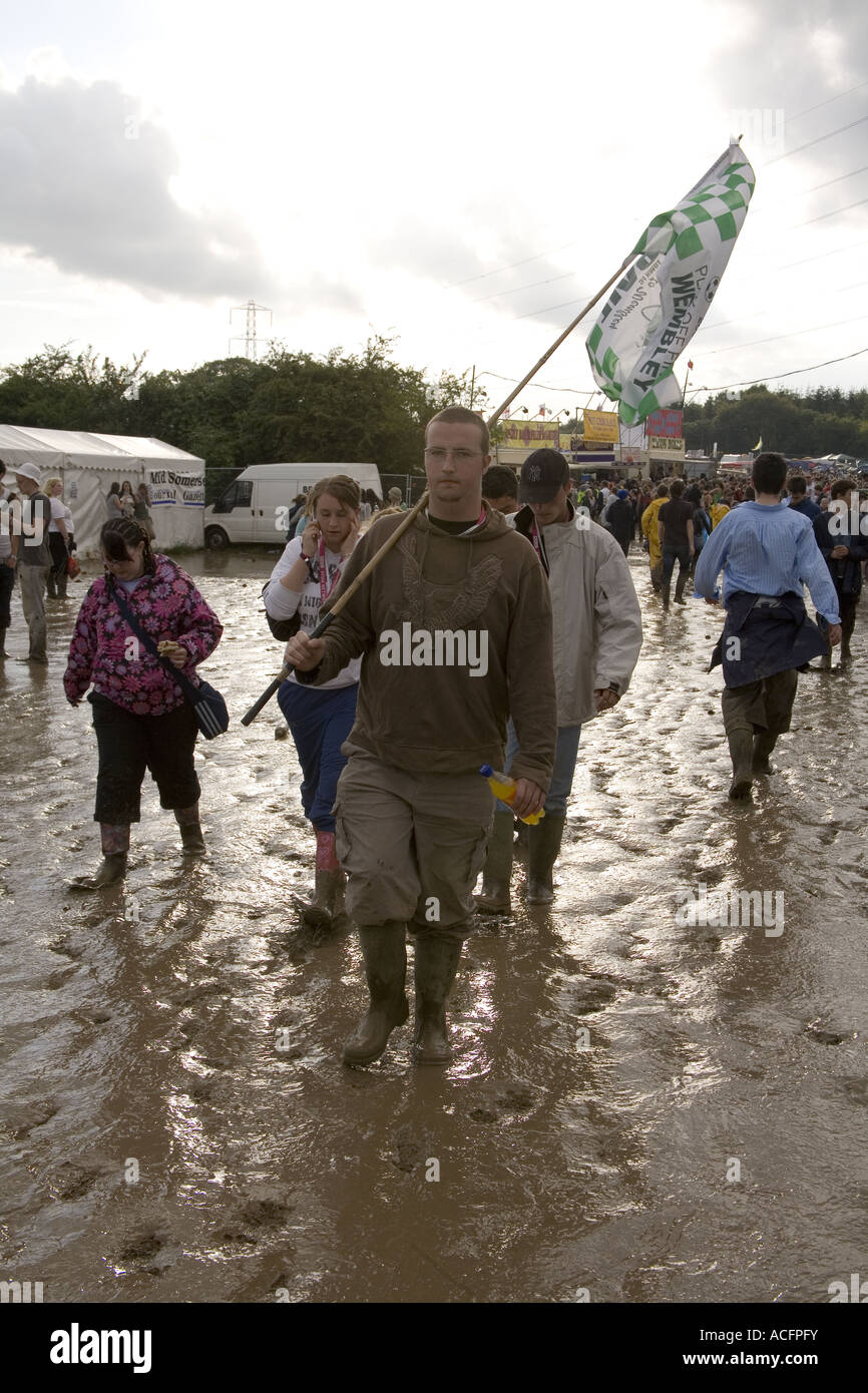 Punters covered in mud at the Glastonbury music festival 2007 Stock Photo