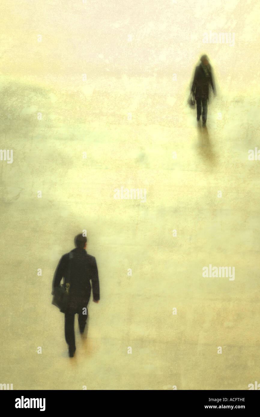 photo of two people walking towards each other Stock Photo