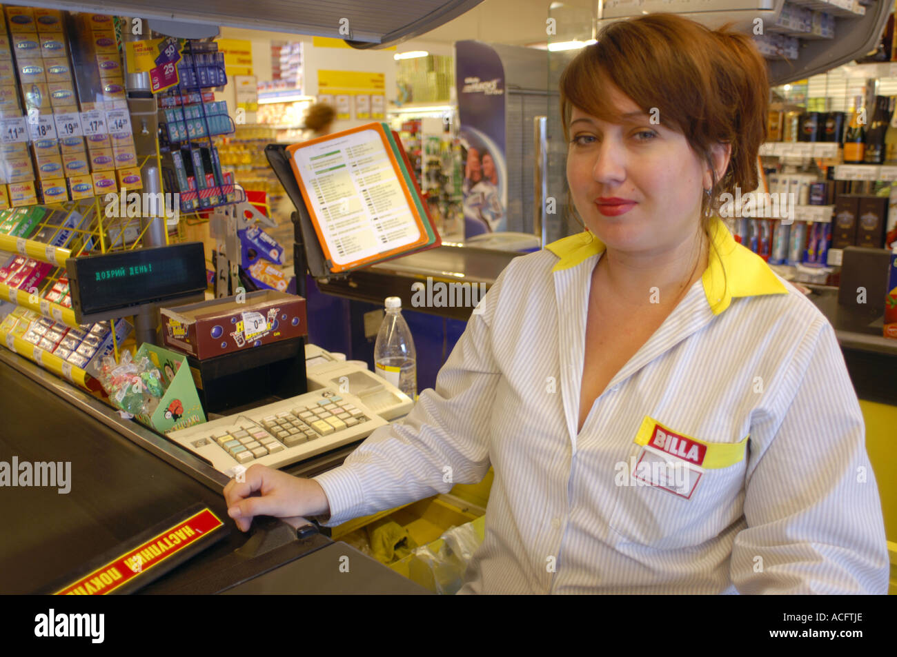 Shop assistant at a supermarket checkout in Kiev, Ukraine Stock Photo ...