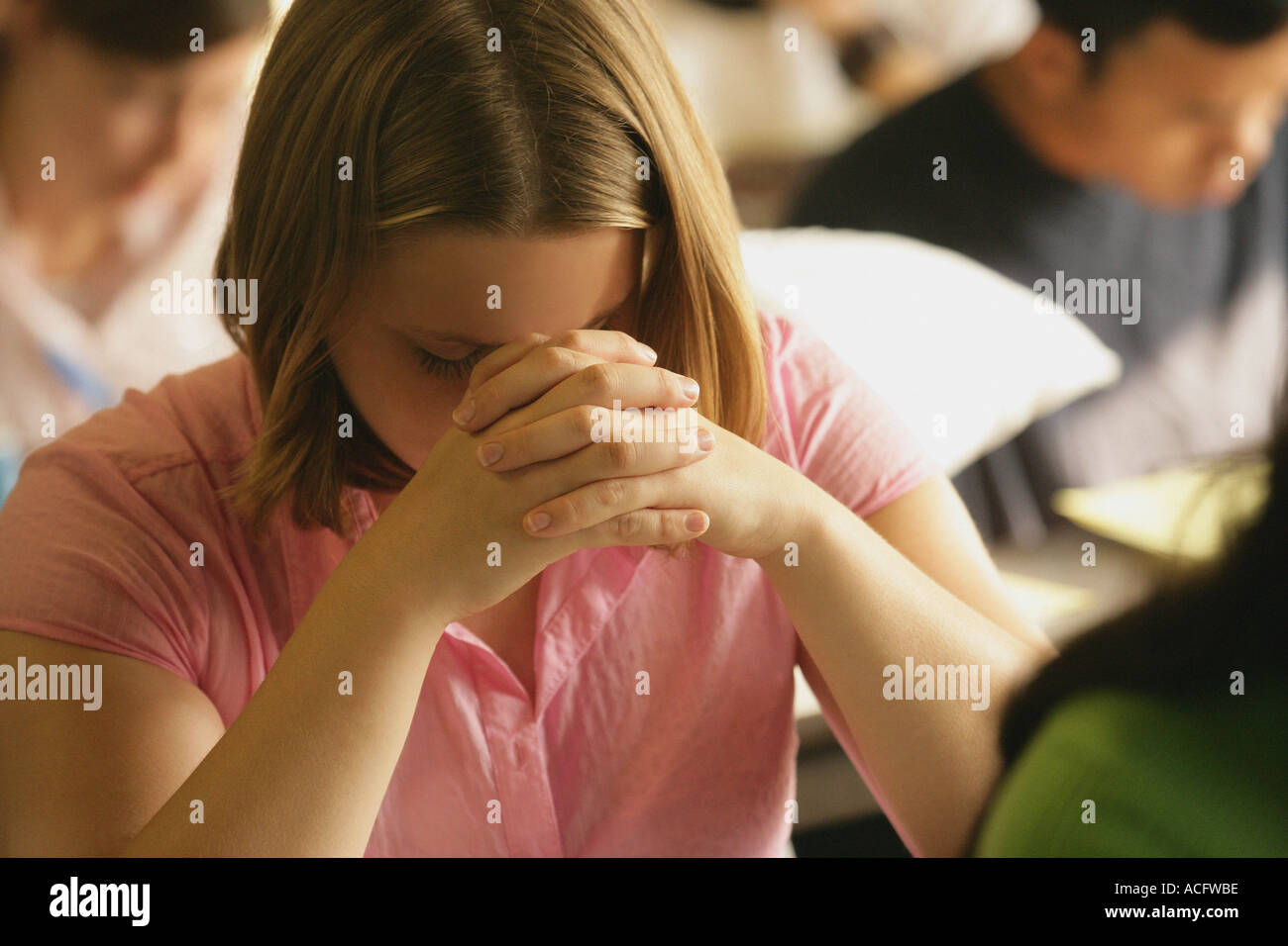 Woman praying Stock Photo