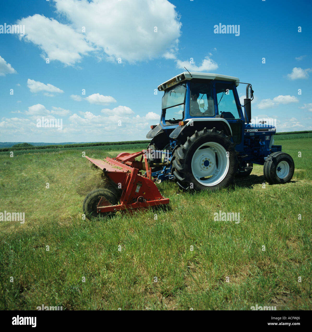 Mowing or topping vegetation in a set aside area of farmland Stock Photo
