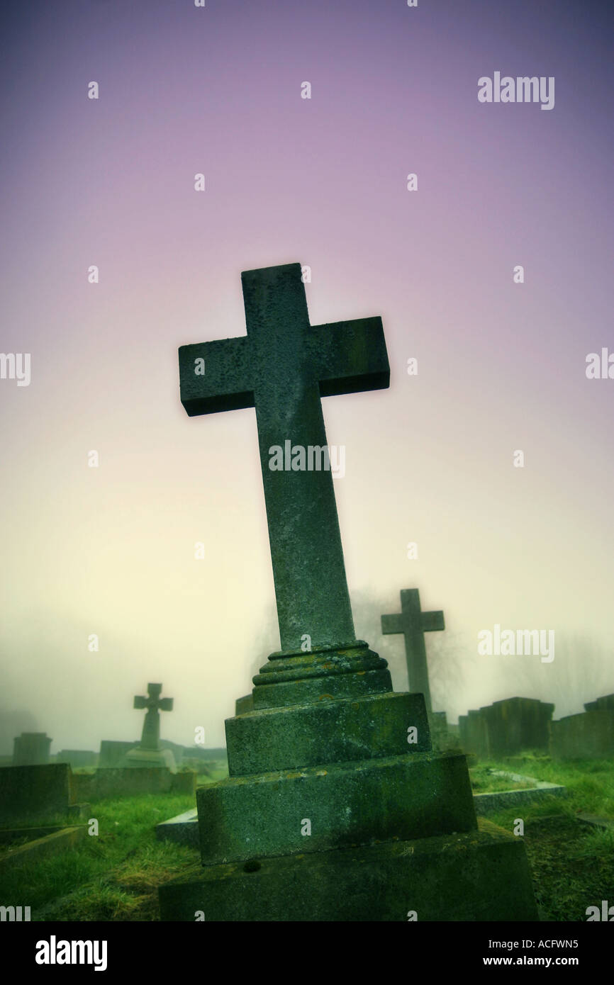 Photo of a cross in a graveyard Stock Photo
