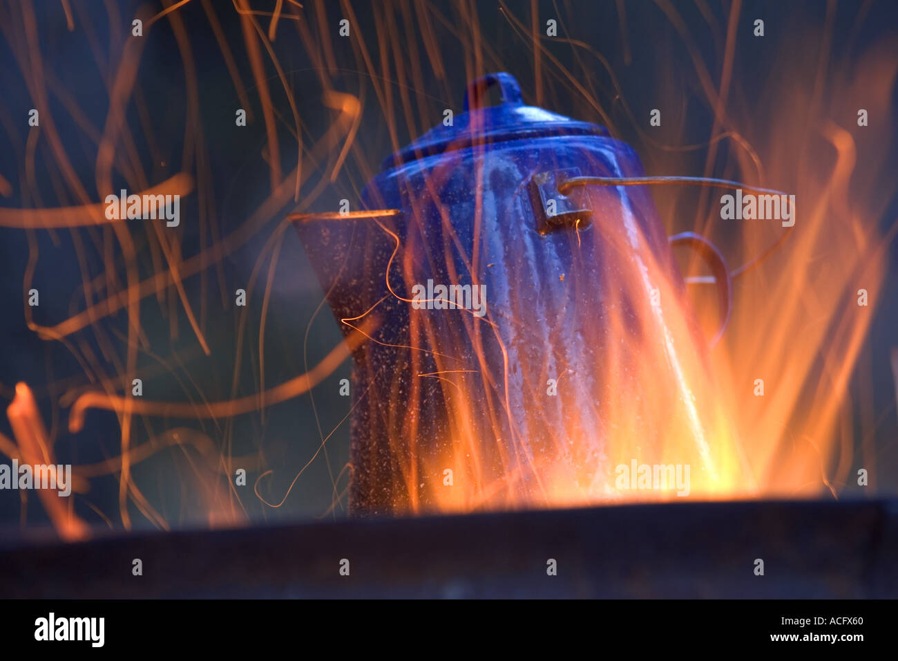 camping kettle over fire Stock Photo Alamy