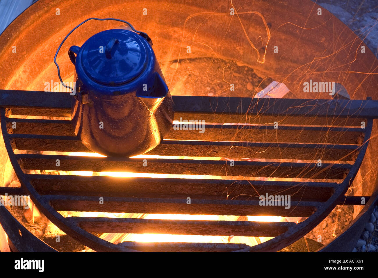 camping kettle over fire Stock Photo Alamy