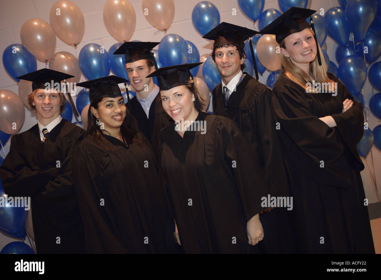 Graduates Bunch Group of graduates Stock Photo - Alamy
