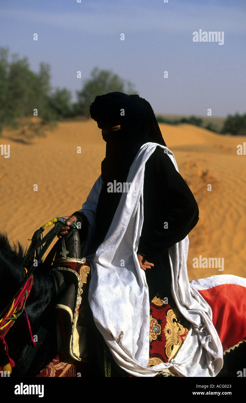 Portrait of nomad bedouin on a horse in Tunisia Stock Photo - Alamy