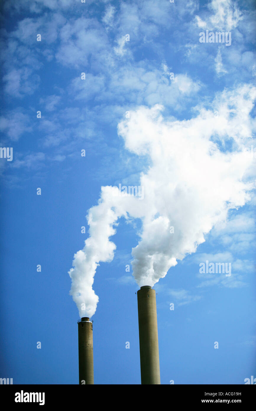 Smoke coming out of chimneys. Stock Photo