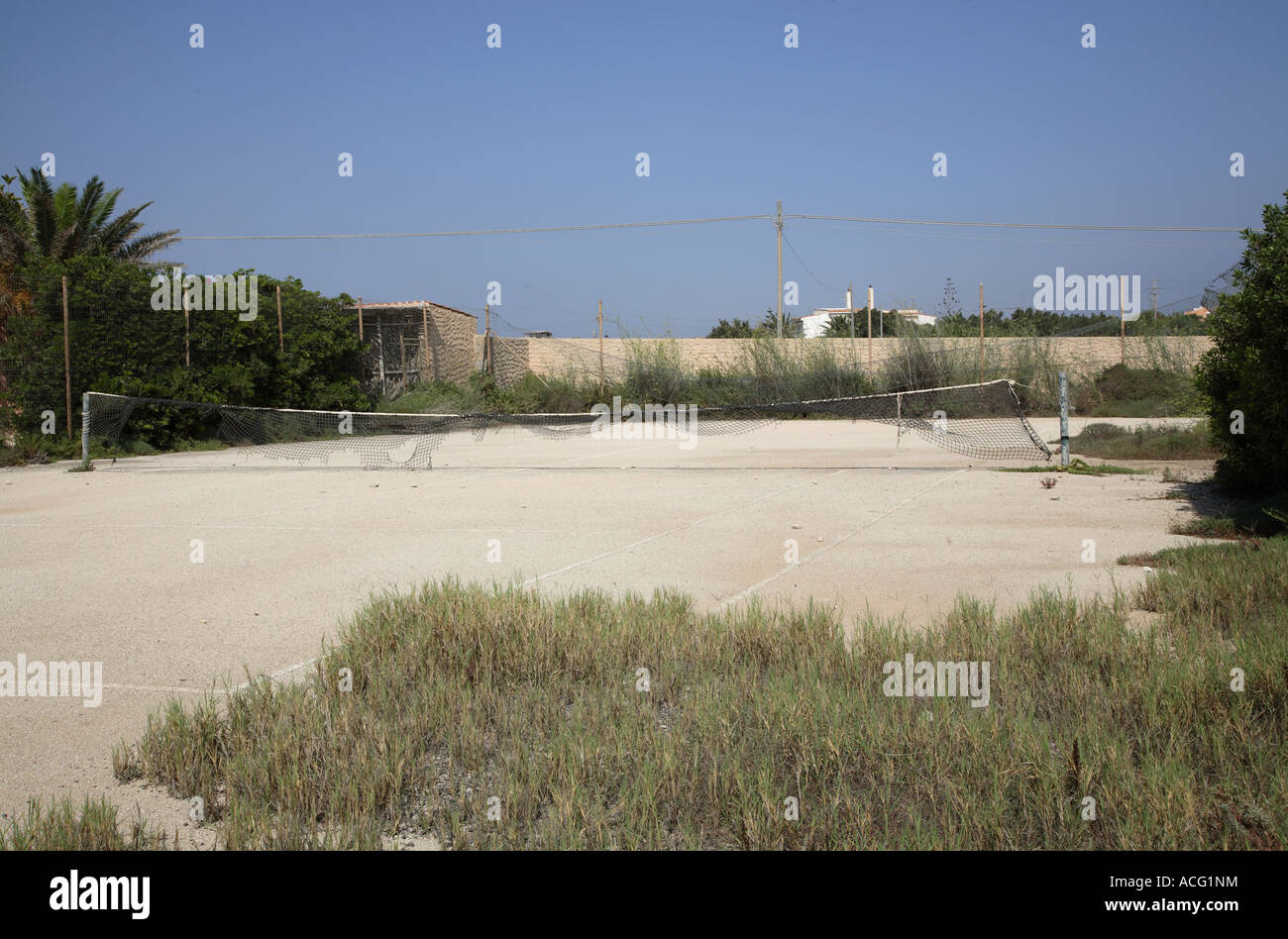 Empty and ruined tennis court Stock Photo