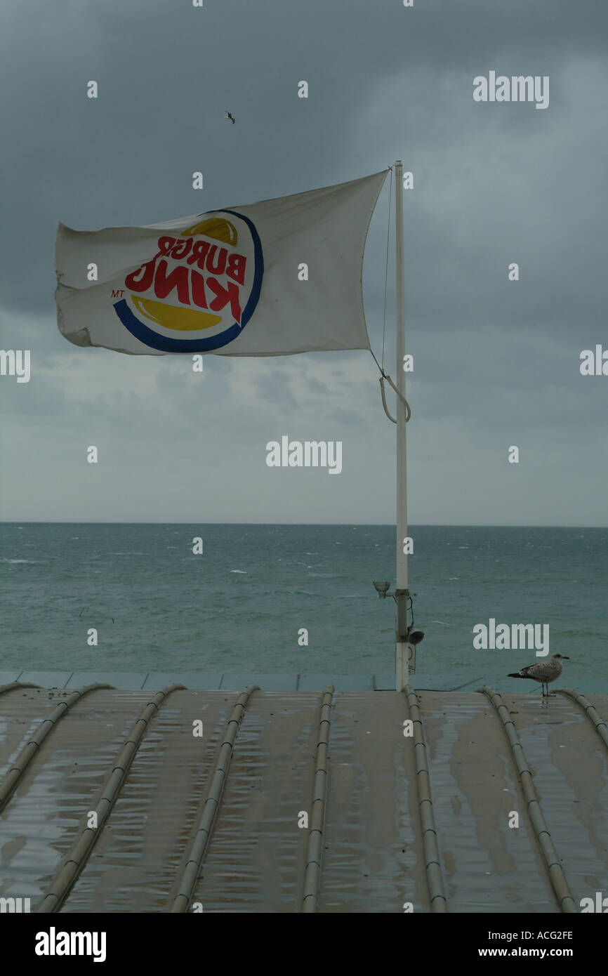 Burger King flag on a roof with sea and sky background Stock Photo