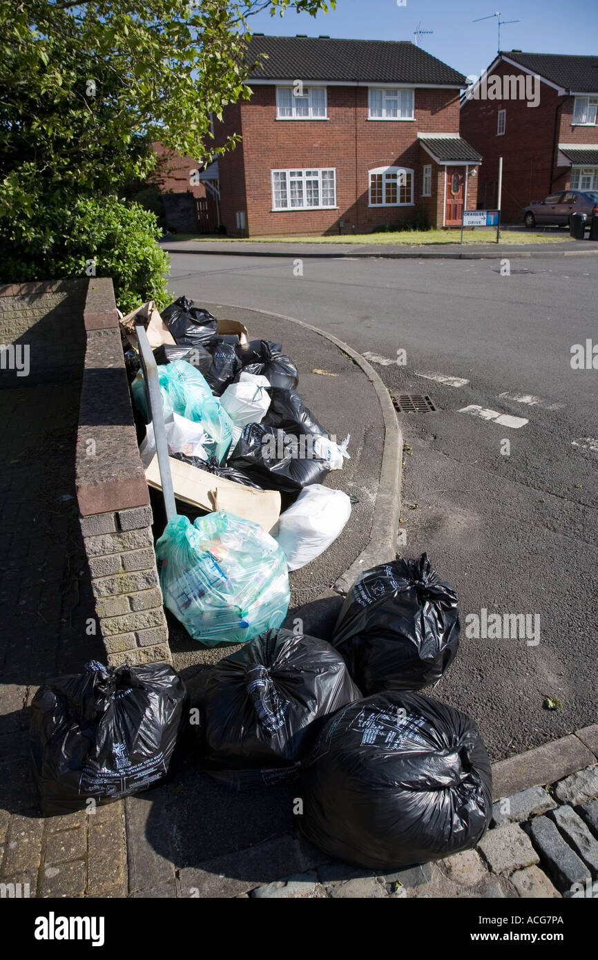 Rubbish waiting for collection on street in suburb of Cardiff Wales UK Stock Photo