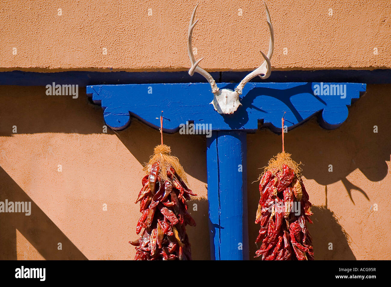 RED CHILE PEPPERS HANGING ON STORE FRONT CHIMAYO, NEW MEXICO Stock ...