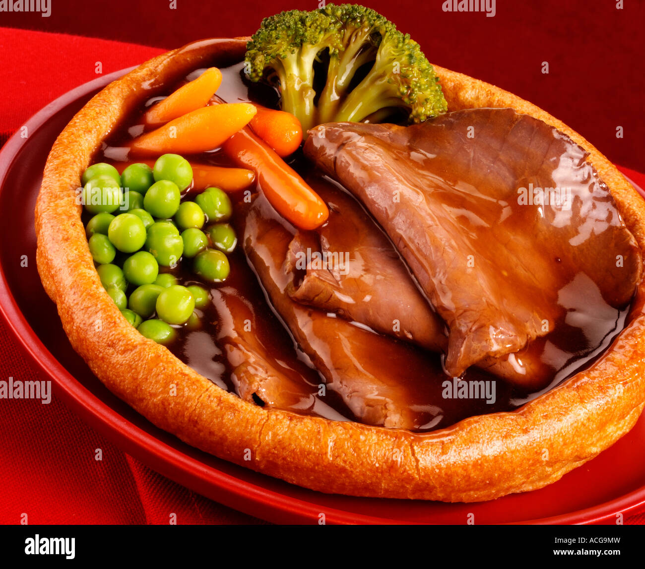 GIANT YORKSHIRE PUDDING WITH ROAST BEEF AND VEGETABLES Stock Photo Alamy