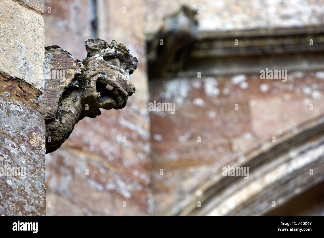 Weathered carved stone Gargoyles on an English church. Oxfordshire, England Stock Photo