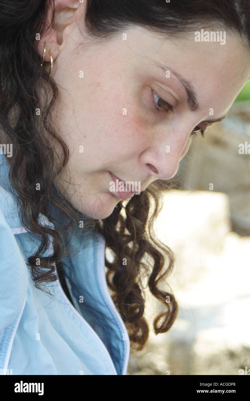 Young woman is looking in the book Stock Photo