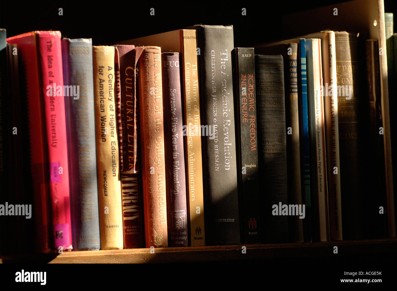 Books line a library shelf Stock Photo - Alamy