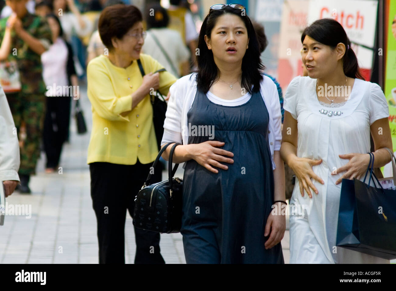 Two Pregnant Women in Myongdong Commercial Market Seoul South Korea Stock Photo