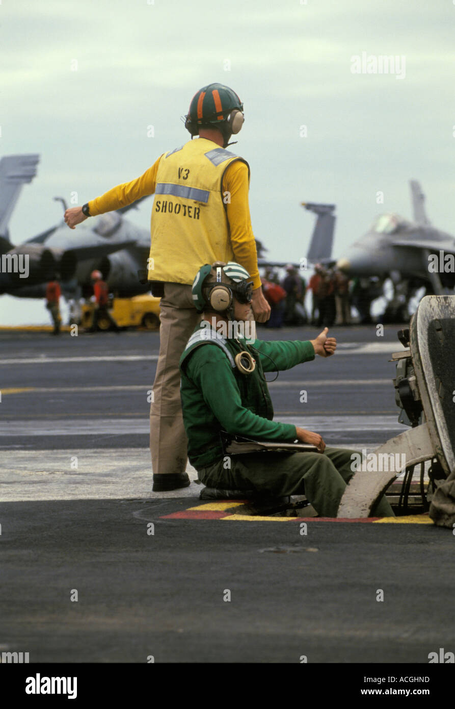 Flight deck officers launch a U.S. Navy F/A18C during flight