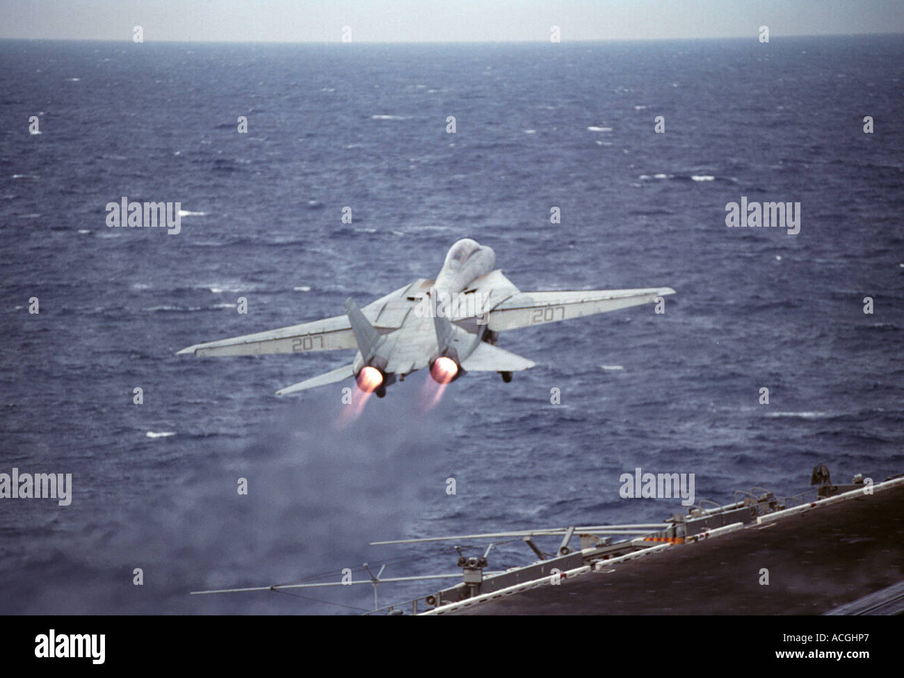 An F-14  Tomcat launches from the flight deck of USS JOHN F. KENNEDY Stock Photo