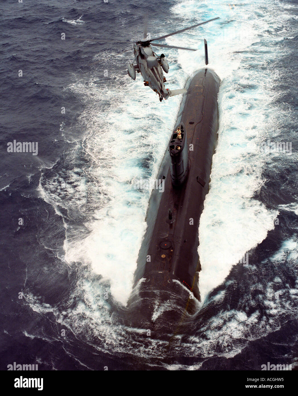 Royal Navy Sea King Mark 5 hovering over Royal Navy Submarine Stock