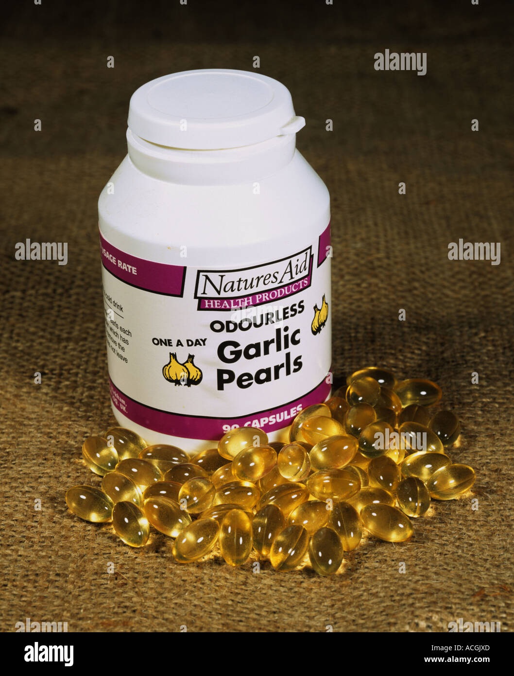 Retail tub of garlic capsules garlic pearls Stock Photo