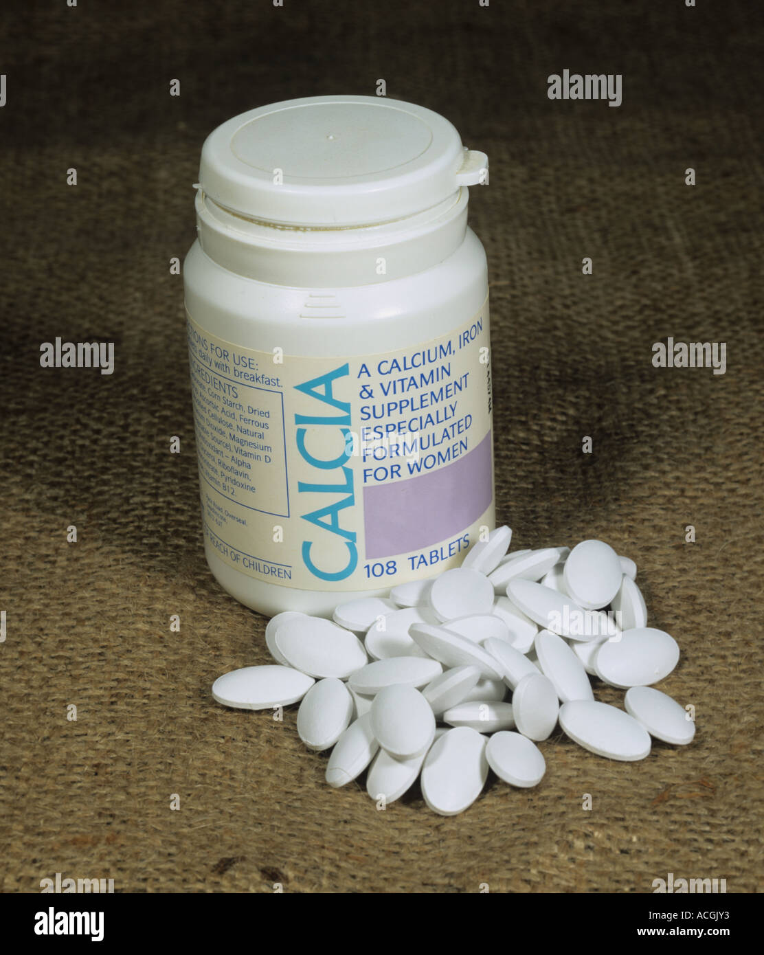 Retail tub of calcium Ca iron vitamin tablets Stock Photo