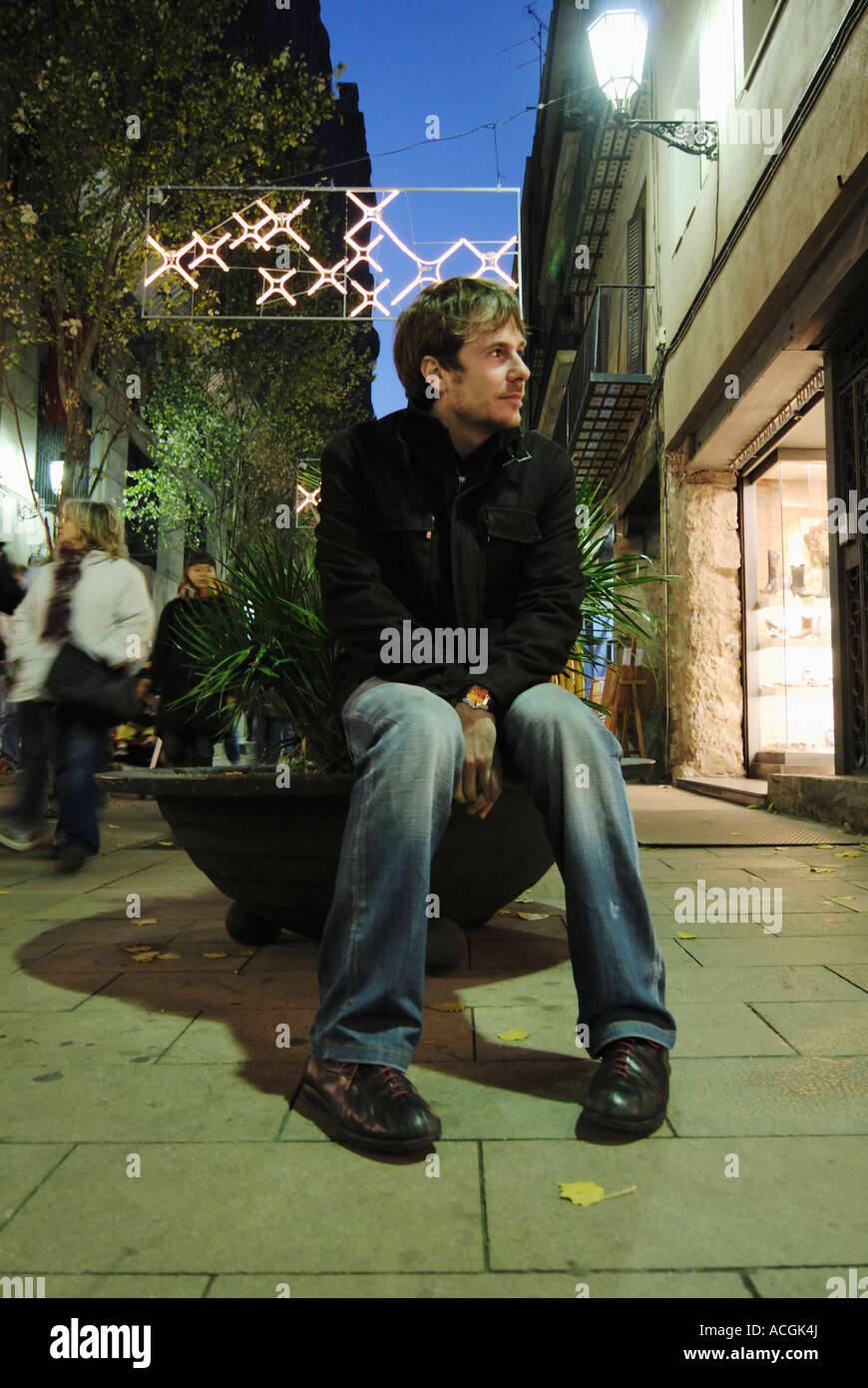 Spain, Barcelona, Man sitting Stock Photo