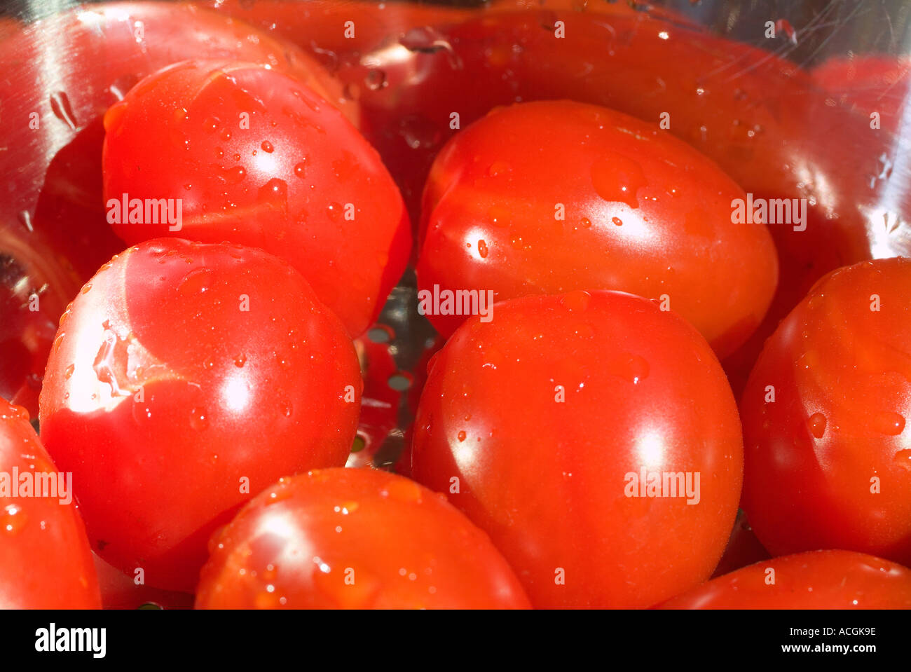 Cherry Tomatoes washed in stainless steel drainer Stock Photo Alamy
