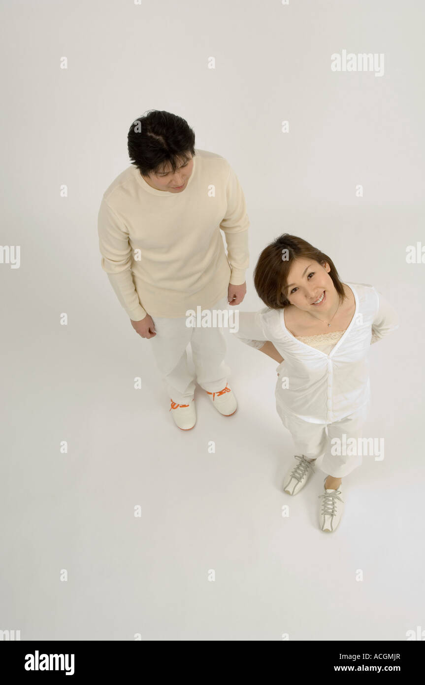 Asian standing hi-res stock photography and images - Alamy