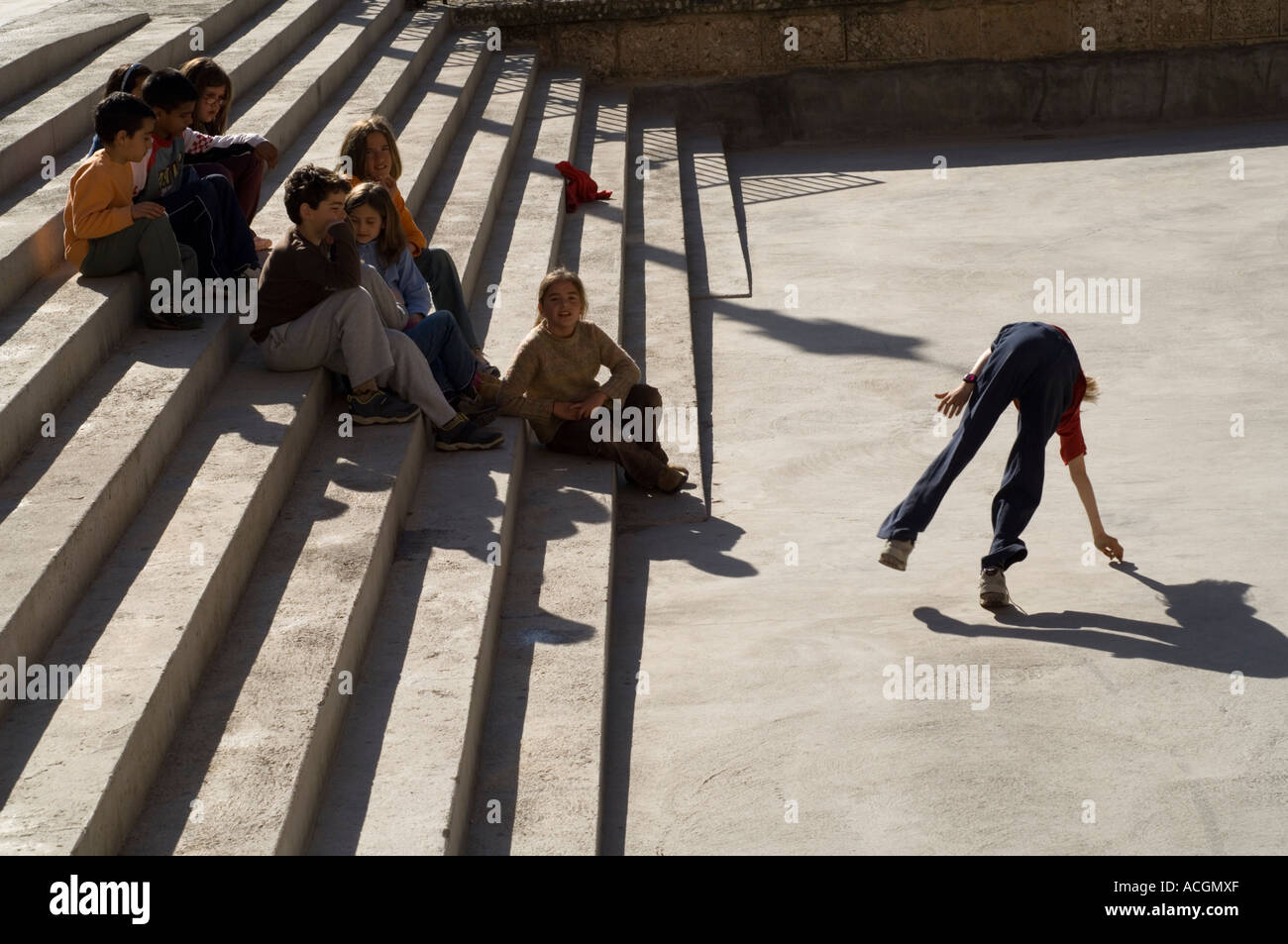 Schoolchildren resting and playing outside the Monastery of Montserrat, Catalonia, Spain, Europe Stock Photo