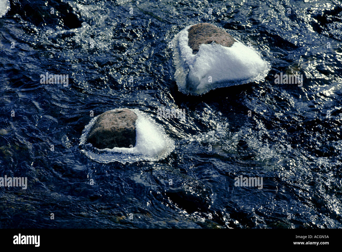 Ice-fringed rocks in the Gelder Burn below Lochnagar on the Royal Balmoral Estate. March. Stock Photo