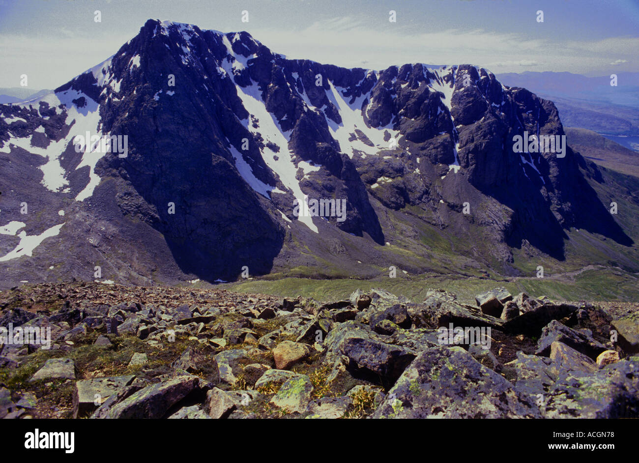 Ben Nevis 4,406ft: the huge 1800ft NE. Face rears over Allt a'Mhuilinn glen. View SW. from Carn Mor Dearg. June Stock Photo