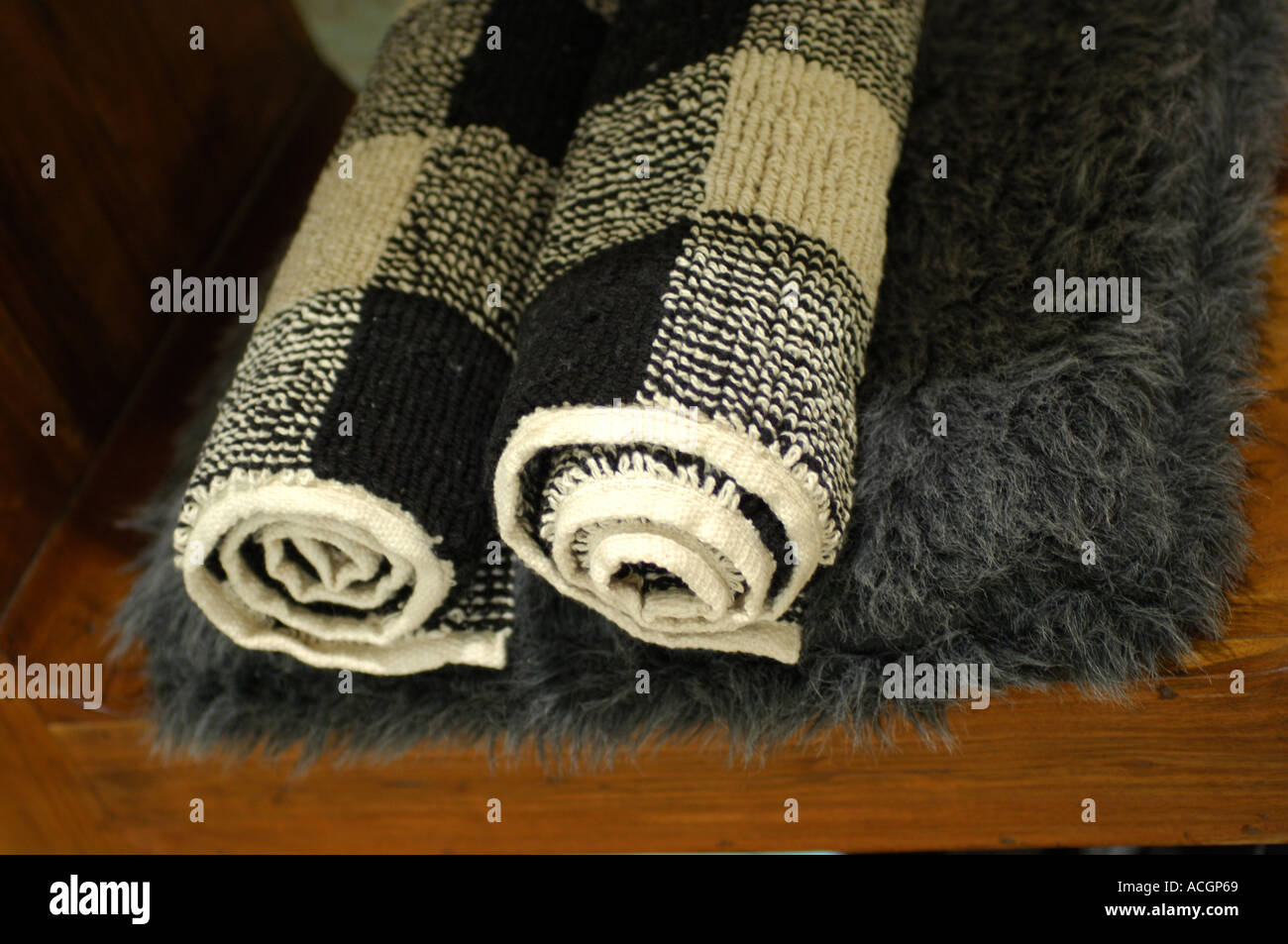 Luxury Chequered Bath mats and grey furry rug Stock Photo Alamy