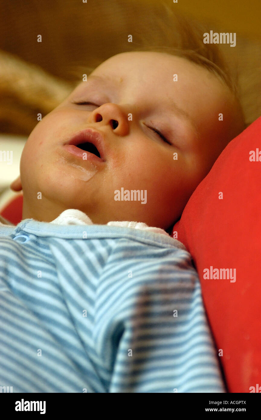 Sleeping baby after feeding Stock Photo Alamy