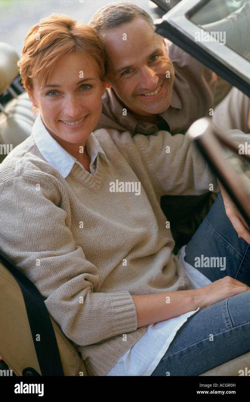 Portrait smiling couple in car Stock Photo - Alamy