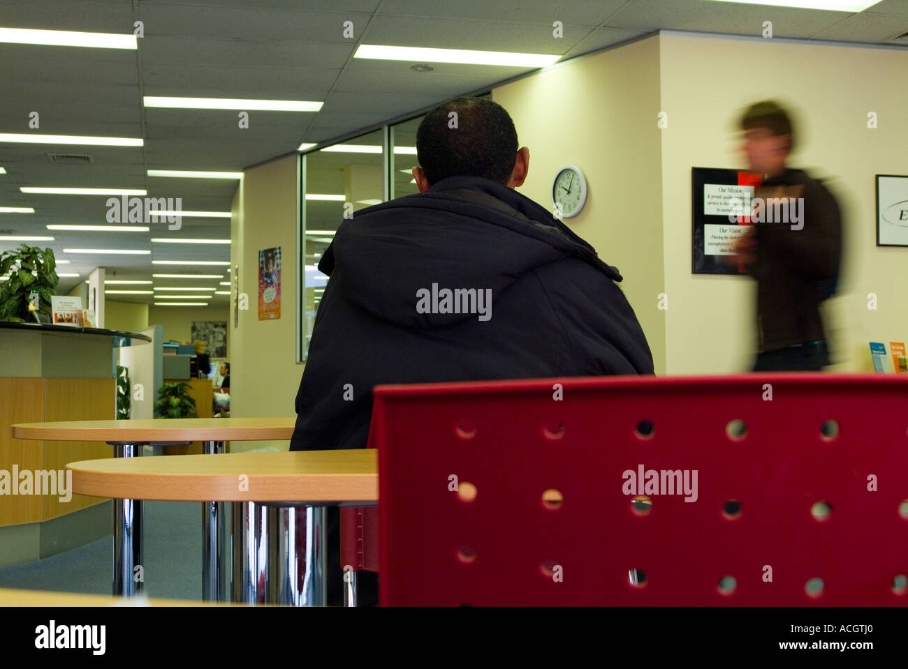 An unemployed person looking for a job waiting for interview in an job service provider office Stock Photo