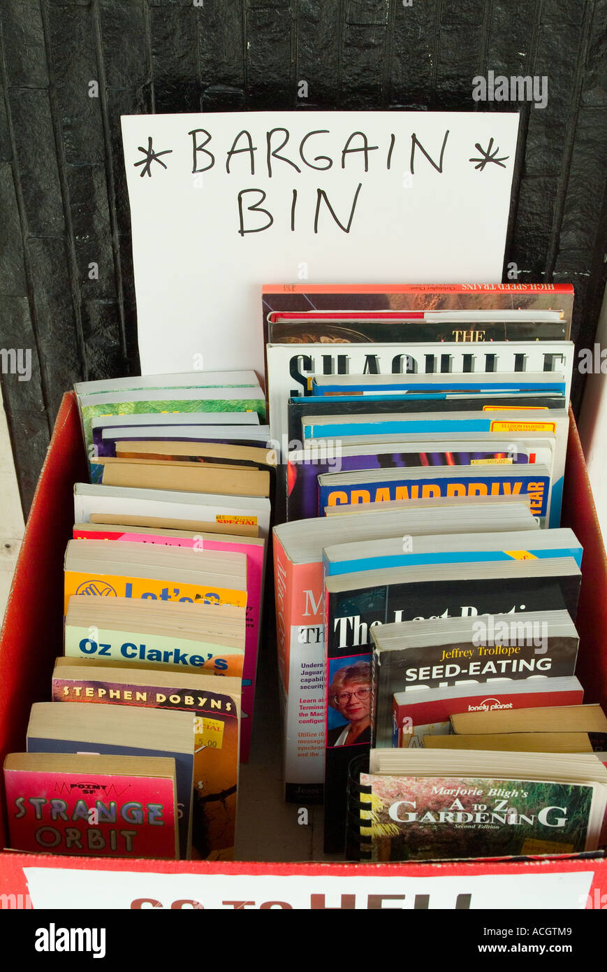 A bin of bargain books outside a bookshop Stock Photo