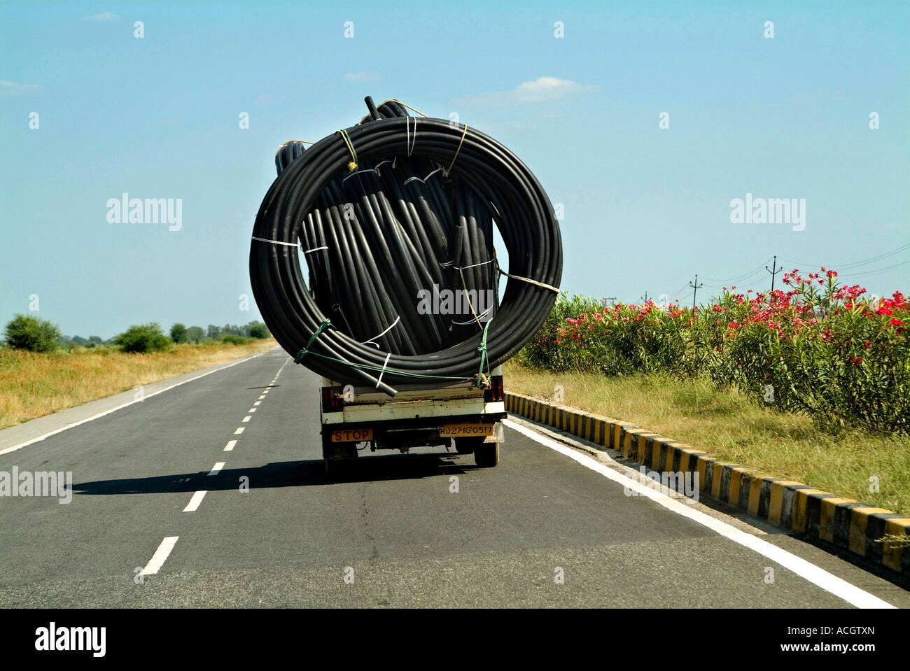 Overloaded with bags of waste, vehicle moves on higway, Shiraz, Iran. –  Stock Editorial Photo © grigvovan #167601202