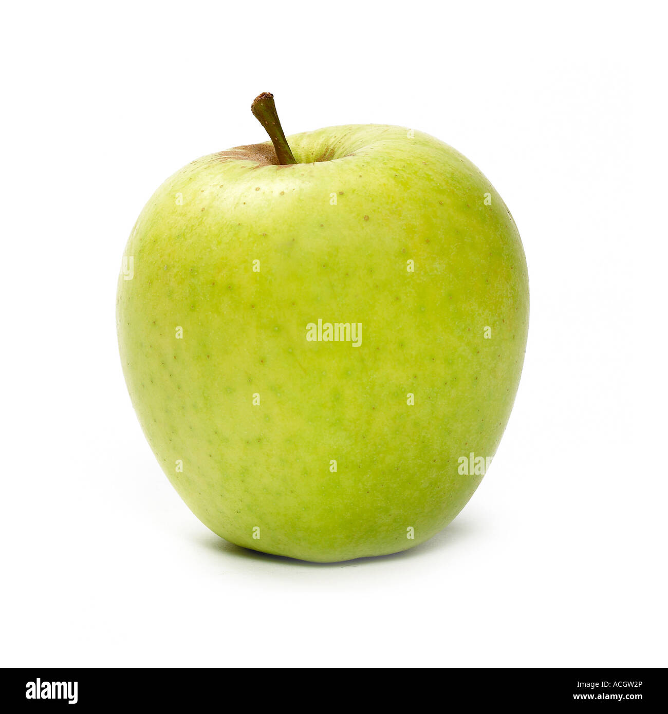 A fresh ripe juicy golden delicious apple on a white background Stock Photo