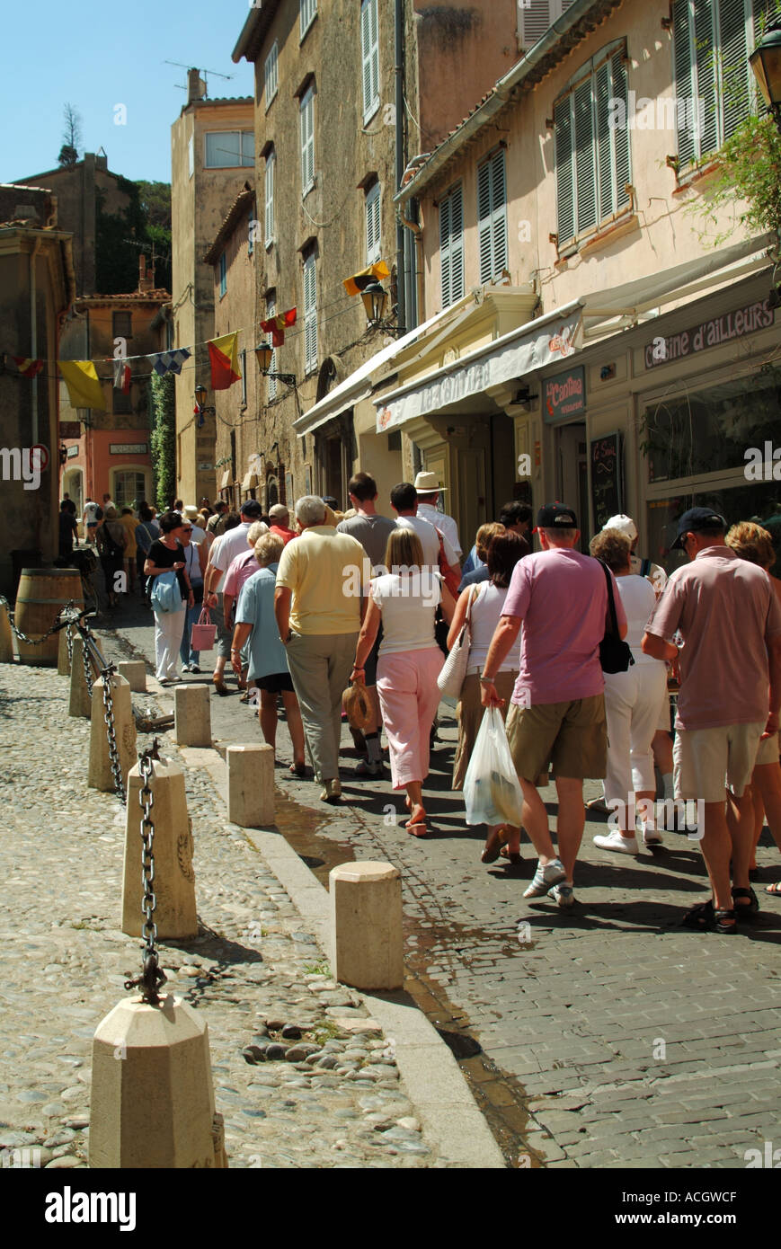 St Tropez group of tourists being shown around the narrow streets by