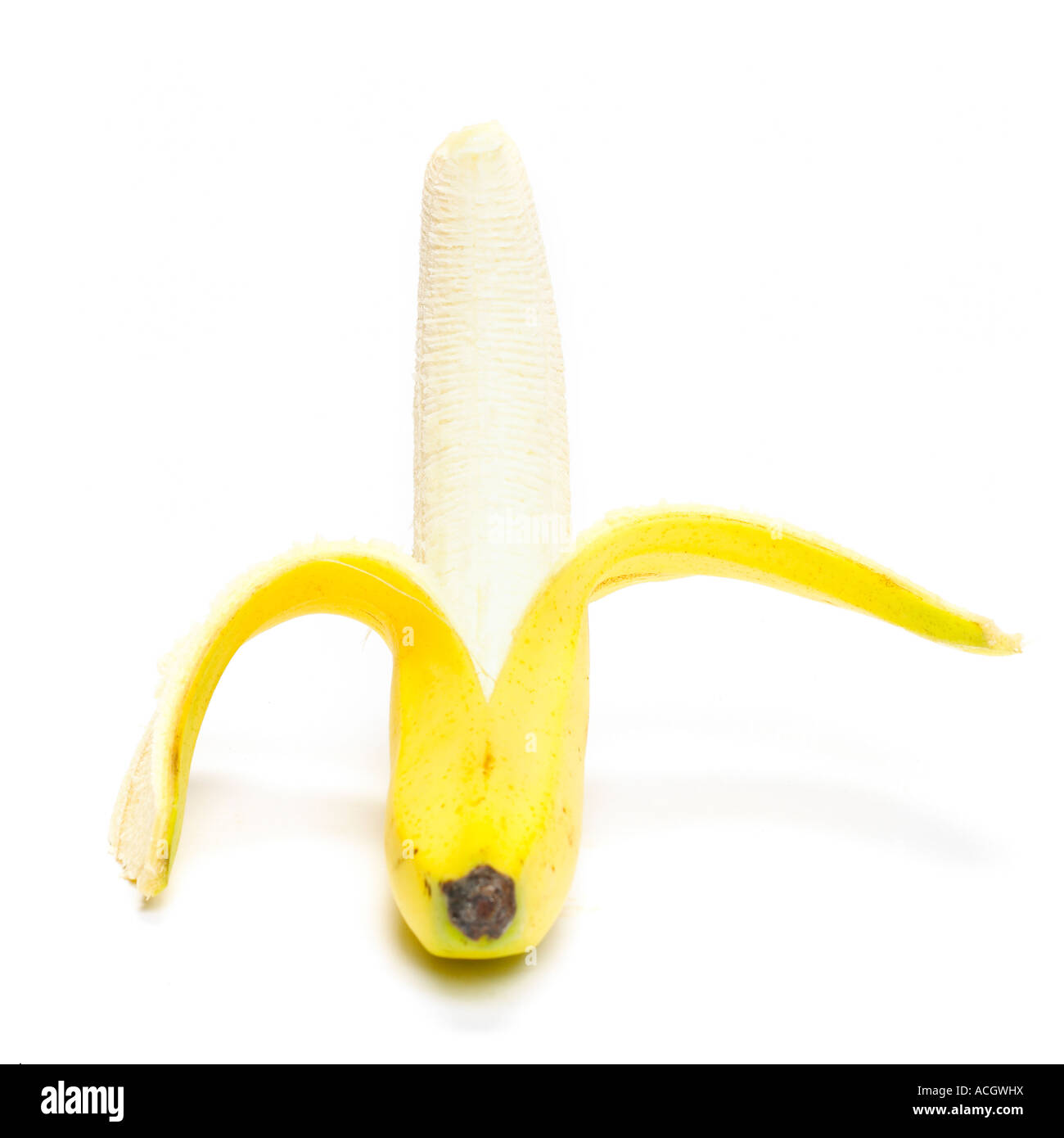 a fresh ripe yellow banana split open on a white background Stock Photo